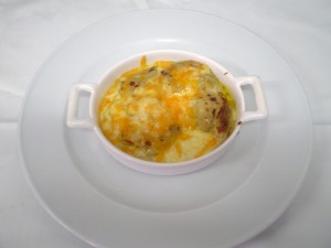 Raviolis rellenos de foie, cebolla confitada y boletus - Restaurante La Aldea Calles